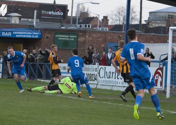 Gainsborough Trinity (blue) score their only goal v Boston United in the the Lincs Senior Shield Final at the Northolme, Gainsborough on Tuesday. Boston ran out winners with a 3-1 victory.