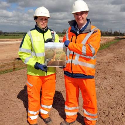 Feature of the progress of the A57 road improvement works, pictured with an aerial view photograph are site agent Anja Reid and project manager Neil Foster