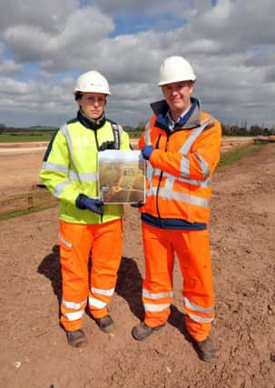 Feature of the progress of the A57 road improvement works, pictured with an aerial view photograph are site agent Anja Reid and project manager Neil Foster