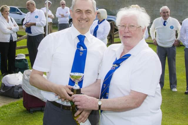 David Gascoyne seen in the photo being presented with the cup and a bottle of wine by Hilary Wignell team Captain for 2013