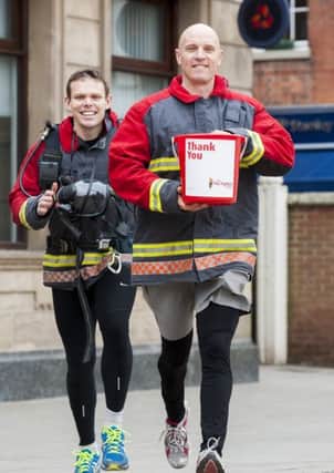 Firefighters Paul Mclafferty and Russell Kay who with the support of Natwest Retford Branch Manager are collecting sponsors to raise funds for The Firefighters Charity as part of team who will be jogging 100K from London to Brighton

4 March  2013
Image © Paul David Drabble