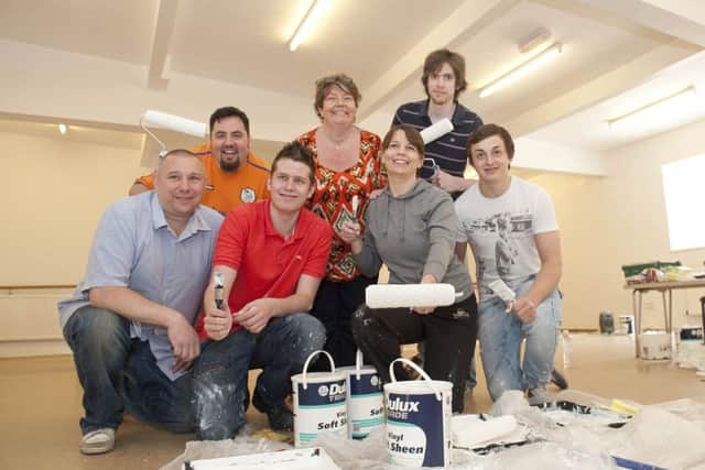 Julie Turner (centre) of Julie Turner Stage Academy thanked work colleagues from Tesco Dinnington store, (left to right); Ian Davies, Mikey Smith, James Davy, Clare Gelder, Luke Fitzpatrick and Will Ives, for helping to re-decorate the Julie Turner Stage Academy Studio 77 premises in Dinnington on Tuesday following fundraising activities at the store