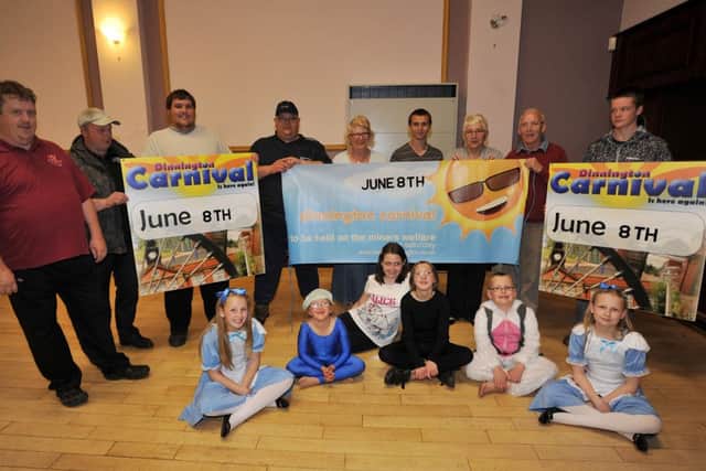 Members of the Dinnington Carnival Committee gather to launch publicity for Dinnington Carnival, pictured are members of the committee with local children (w130521-2)