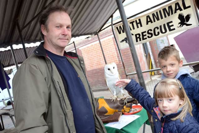 Birds of Prey from Wath Animal Sanctuary visited Dinnington Market on Saturday. Pictured are Ian Stacey, Ollie Thompson, six, and Jasmine Thompson, five G130518-6