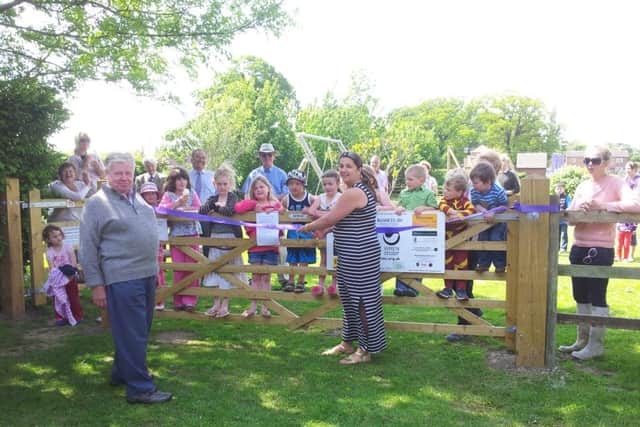 Dunham-on-Trent parish councillor Kathryn Watkinson and chairman Maurice Matthews pictured with local children at the opening of the new play park