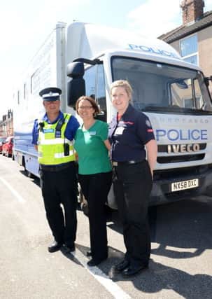 West Lindsey District Council, Lincs Police and Lincs Fire Service held a drop in surgery on Stanley Street in Gainsborough. Pictured are PCSO Mel Crabtree, Hannah Cann, Empty Property Officer at WLDC, Alison White from Lincs Fire Service G130604-3a