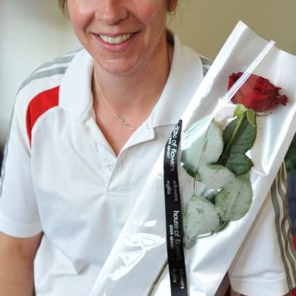 Guardian Rose presentation to PE teacher Mary Paton (w130607-1d)