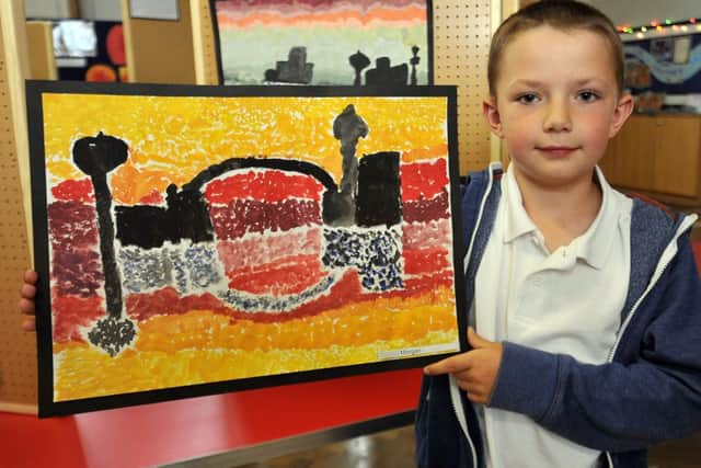 Woodsetts Primary School held an exhibition of art work from all year groups at the school. Pictured is Morgan with his painting (w130605-2f)