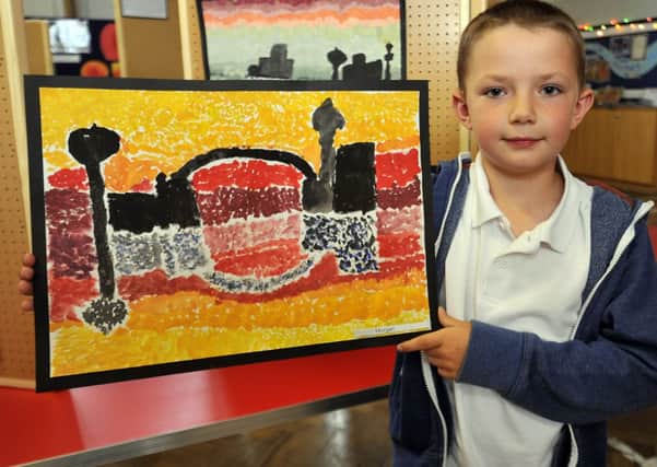Woodsetts Primary School held an exhibition of art work from all year groups at the school.  Pictured is Morgan with his painting (w130605-2f)