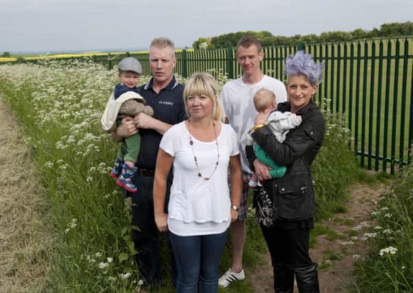 Throapham resident Julieanne Curtis and her neighbours protest against fencing erected around Dinnington Comprehensive School playing fields preventing public access
