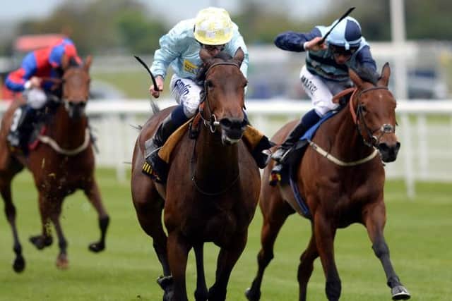 Liber Nauticus ridden by Ryan Moore (centre) go on to win the Tattersalls Musidora Stakes during the Tattersalls Musidora Stakes Day of the 2013 Dante Festival at York Racecourse. PRESS ASSOCATION Photo. Picture date: Wednesday May 15, 2013. See PA story RACING York. Photo credit should read: John Giles/PA Wire