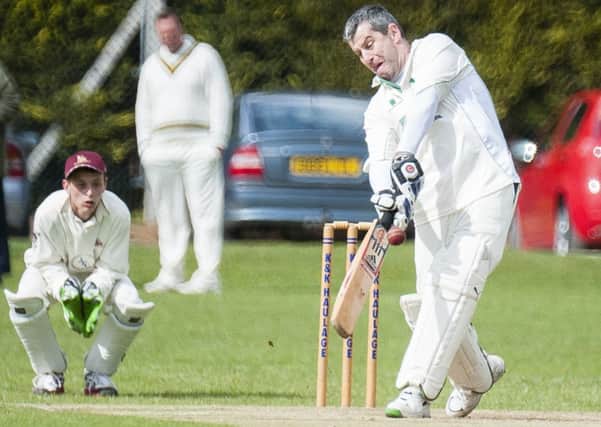 Everton Batsman John Waghorn hits a for from a ball  by Lee Stead watched by Marshalls wicket keeper Jamie Flavel during play at Marshalls ground worksop on Saturday afternoon

11 May 2013
Image © Paul David Drabble