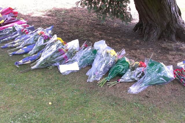 Friends of Callum Wilkinson laid flowers for him following a minutes silence on Saturday