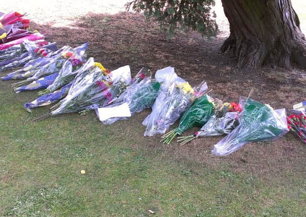 Friends of Callum Wilkinson laid flowers for him following a minutes silence on Saturday