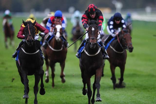 Carinya ridden by Tom Eaves (second right) comes home to win the B&M Installations Handicap ahead of Carragold ridden by Duran Fentiman (left) at Nottingham Racecourse. PRESS ASSOCIATION Photo. Picture date: Wednesday November 2, 2011. Photo credit should read: Andrew Matthews/PA Wire.