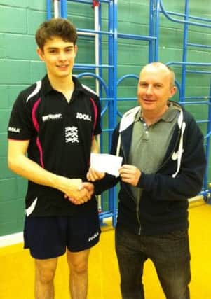 Pictured is Worksop's Sam Walker reigning English U21 National Champion who is receiving a cheque from Andy Lee Chairman of The Worksop & District Table Tennis League in recognition of all Sam's achievements in the sport.