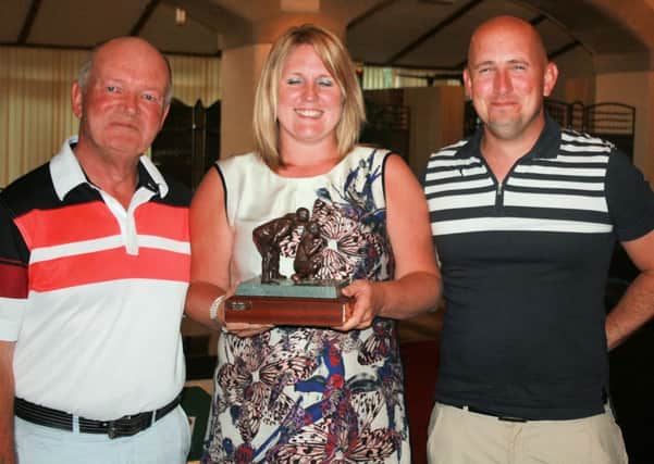 Martin Lewis, the husband of the late Jill Lewis presenting awards to Joelle Davies and partner Tom White