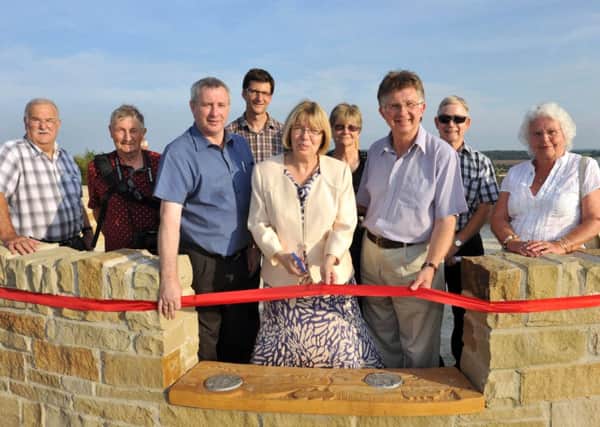 Official opening of new view point at Shireoaks, pictured is Coun Sybil Fielding cutting the ribbon watched by local councillors and members Friends of Woodlands (w130716-4a)