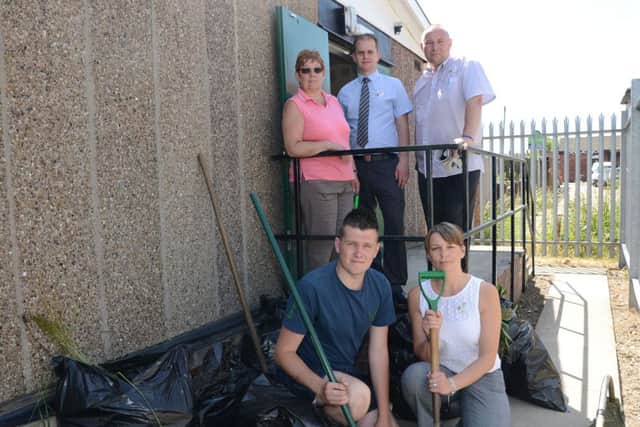 Staff from Tesco in Dinnington helped to tidy up the area around the Scout hut on Laughton Road G130709-3a