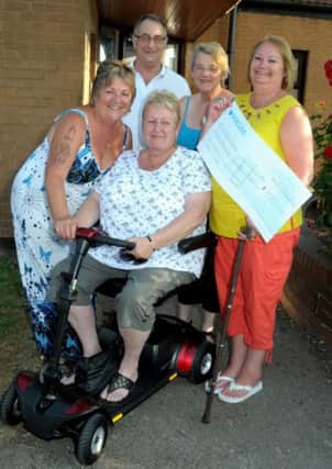 Kilton Forest Community centre, Worksop, have been able to help two good causes, with Clairvoyance eveings, held at the centre.They have provided a £720 Mobility Scooter for terminally ill group member Hazel Bonser of Langold, and presented £300 to Lincs & Notts Air Ambulance. Pictured are Hazel Bonser on her Mobility Scooter, with Pam, Sue Downing and Paula Parry, organisers, and Hazel's husband Tom Bonser. (w130722-1b)