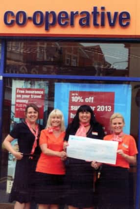 Co-Operative Travel Worksop hand over a cheque for the Bassetlaw Hospital Scanner appeal