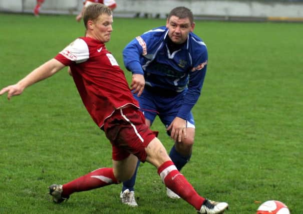 EVO-STIK LEAGUE - South Division One 2011/12
Leek Town (blue) Vs Ilkeston (red)
Leek Town Matt Haddrell & Ilkeston Josh Hill