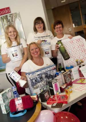 Staff at the Britannia part of the Co-Operative Bank  (l-r) Kathryn Ramsy, Janine Cordall, Sarah Watson and Shane Burke, fundraising for their chosen charity the Carers Trust on Wednesday