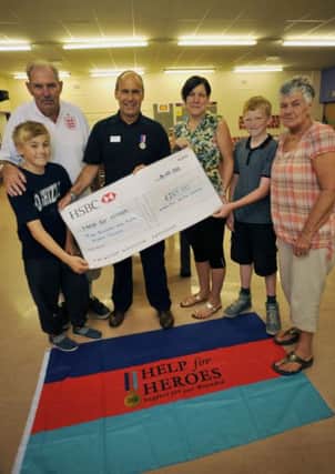 Carlton Youth Club have been fundraising for Help for Heroes, raising over £260. Pictured from left are Luke Darby, 12, Graham Cooper, Help for Heroes Tony Eaton, Tracey Cooper, Charlie Page, 12 and Maggie Cooper (w130731-1b)