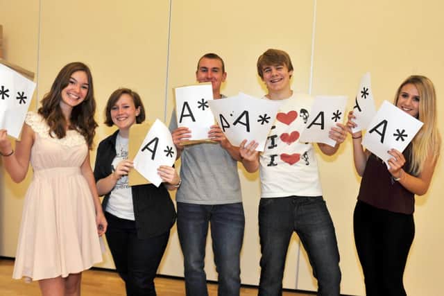A Level results 2013, high achieving students at Outwood Post 16 Centre celebrate their results. Pictured from left are Isabelle Jefford, Ellen Greyling, Ryan Brown, Liam Rodgers and Elise Marks (w130815-1a)