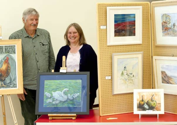 Worksop Society of Artists Summer Exhibition on display at Ryton Park School, Worksop. Artists Malcolm Lodge and Jane Payne and a sample of the art work on display