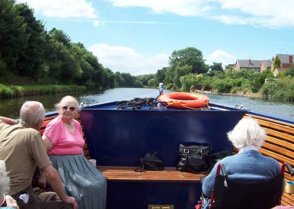 Residents from HC-One Swallownest Care Home enjoying the scenery on the boat trip