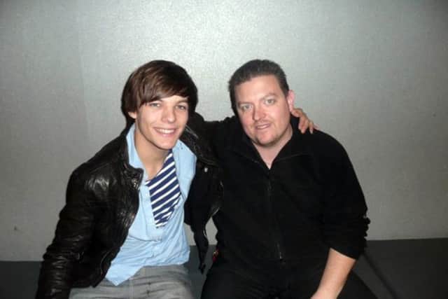 Louis Tomlinson from One Direction with former workmate Wayne Gregory, manager at Savoy Cinema Worksop.