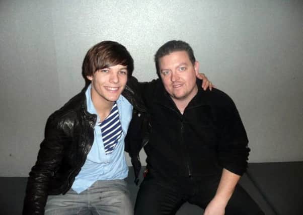 Louis Tomlinson from One Direction with former workmate Wayne Gregory, manager at Savoy Cinema Worksop.