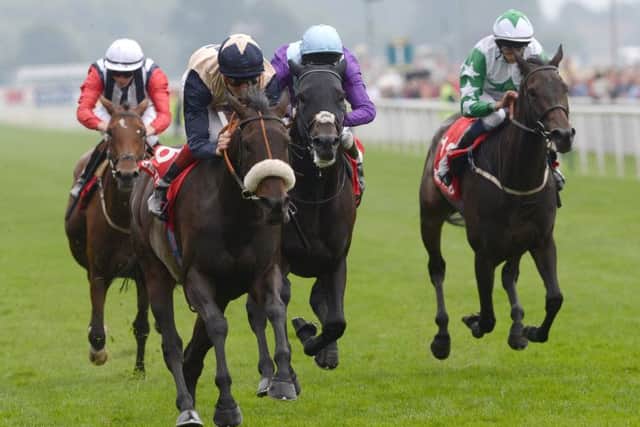 Dark Crusader and Fran Berry (second left) win the Betfred Melrose Stakes during day four of the 2013 Yorkshire Ebor Festival at York Racecourse, York. PRESS ASSOCIATION Photo. Picture date: Saturday August 24, 2013. See PA story RACING York. Photo credit should read: John Giles/PA Wire