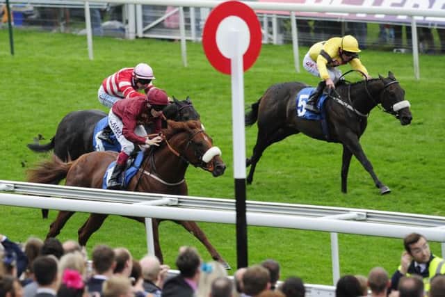 Jamie Spencer and Hot Streak (left) win the Julia Graves Roses Stakes during day four of the 2013 Yorkshire Ebor Festival at York Racecourse, York. PRESS ASSOCIATION Photo. Picture date: Saturday August 24, 2013. See PA story RACING York. Photo credit should read: John Giles/PA Wire
