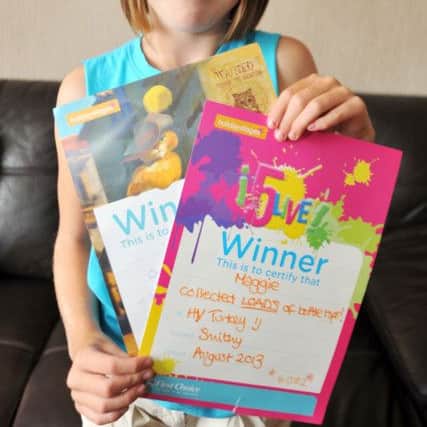 Maggie Anne Grant, 10 collected enough bottletops while on holiday in Turkey to supply a wheelchair for a disabled child, Maggie Anne is pictured with her certificates