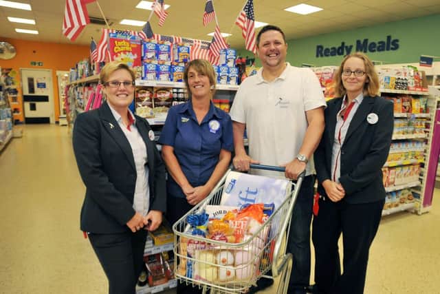 Tesco Celtic Point are supporting 7 Project with the donation of food items, pictured from left are store manager Karen Farrar, customer assistant Rachael Duffy, 7 Project's Shaun Cummings and store deputy manager Joanne Leibrick (w130923-5a)
