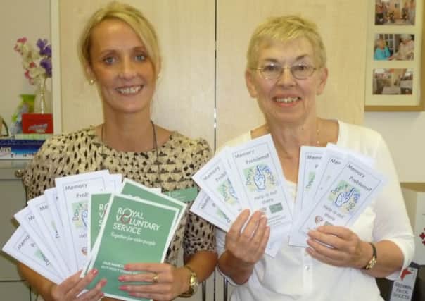 Jan Williamson, right, and Videlle Hamlet with copies of the leaflet