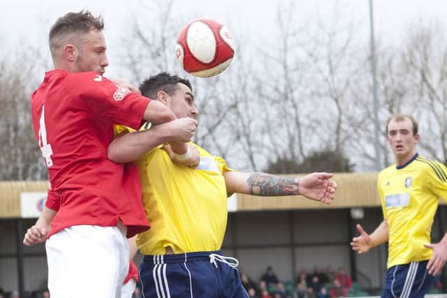 Chorley's Andy Teague battles with Worksop's Leon Mettam. Pic by Alan Janaszek/PhotoPro Images