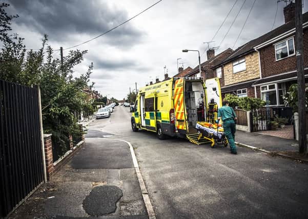 EMAS ambulance paramedic and stretcher - taken by Blast Films