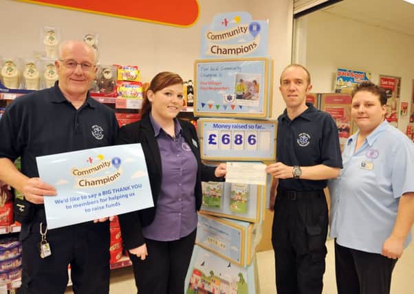 Lincolnshire Cooperative Society have raised £686 for Five Villages First Responders through their Community Champion scheme at Misterton Coop, pictured from left are first responder Colin Gibson, store deputy manager Andi Jones, first responder Martyn Johnson and store supervisor Emma Wilson
 (w131016-2a)