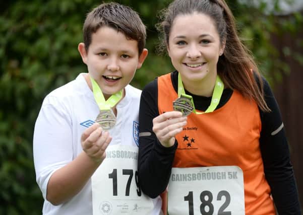 Bradley Dawes, 14, and Molly Hawcroft ran the Gainsborough 5k for charity. Bradley ran for Candles charity in LIncoln and Molly ran for MS charity G131022-1a