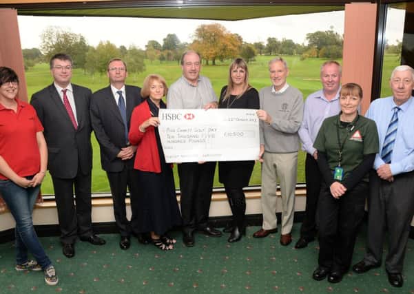Gainsborough Golf Club present cheques to 6 local charities after a charity golf day G131022-2