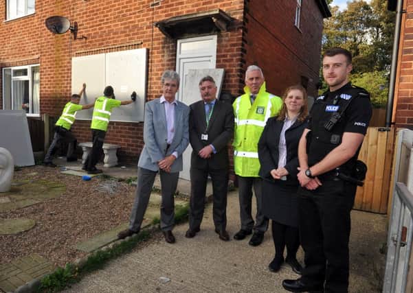 Boarding up of crack house on Garside Street, pictured are from left Bassetlaw Council deputy leader Griff Wynne, Coun Glynn Gilfoyle, community safety officer Gerald Connor, anit social behaviour officer Louise Elliott and PC Mark Topham