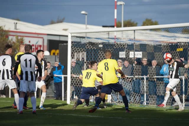 Worksop Town (yellow shirts) v Chorley (black/white) at Sandy Lane