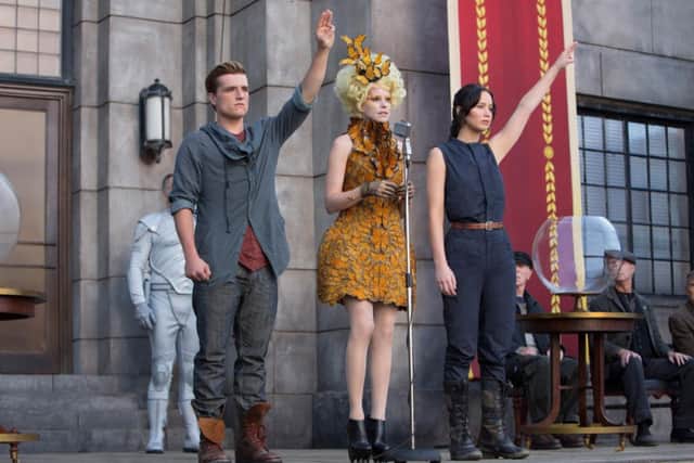 Elizabeth Banks, Josh Hutcherson and Jennifer Lawrence in The Hunger Games: Catching Fire.
