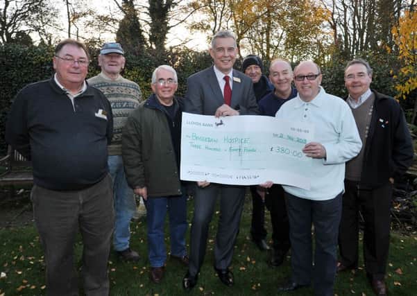 Cheque presentation to Bassetlaw Hospice from members of Bassetlaw Sports and Social Club who raised £380 at a sponsored fishing match (w131121-3)