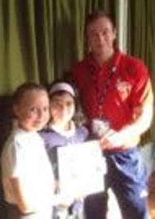 Rob Watson with two pupils from Sir Edmund Hillary Primary School