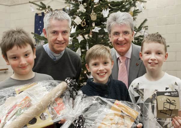 The Crossing Church and Centre hosted a Christmas baking competition with entries judged by the Revd. Geoffrey Clarke and Bassetlaw District Council deputy leader Griff Wynne. The three winners were: first place, Joshua Jordan (centre), second place, Kieran Sime (left) and third place, Jack Taylor.