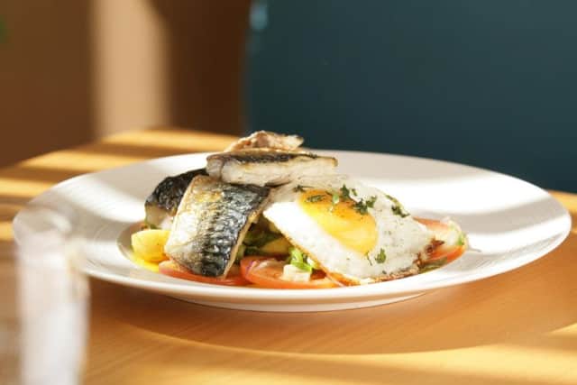 Seabass with Bombay potatoes and fried egg.  PA Photo/Fish is the Dish.